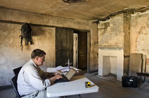 Carl Lounsbury working on hsitoric structure report in the stabl