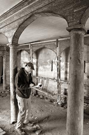 Orlando Ridout working on hsitoric structure report in the stabl