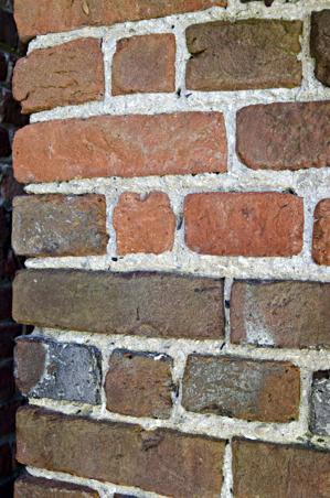 Voids in the mortar of the tower for setting a string line to ke