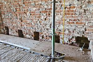 Masonry pockets for setting original joists between the first an