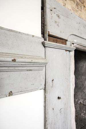 1730s chamber over the hall; brass knob on mantel to hang tools