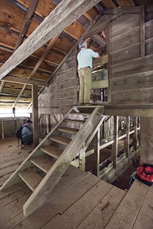 Carter Hudgins examining stalls from above