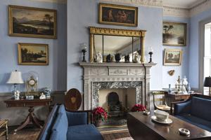 Drawing room with ornament on mantel added during restoration ma
