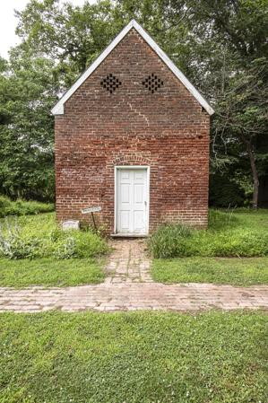 Smokehouse of ca. 1820 converted to a residence in the 20th cent