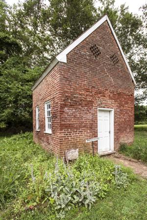 Smokehouse converted to a dwelling in 20th century