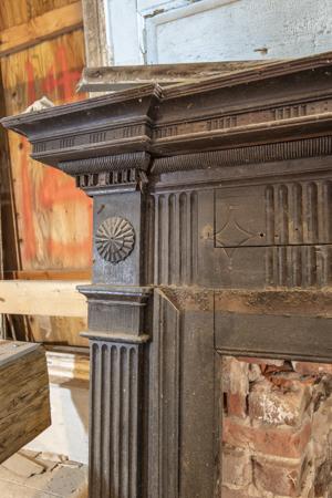 Neoclassical walnut mantel added in the early 19th century