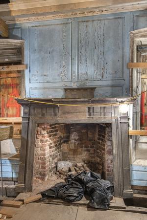 Neoclassical walnut mantel added in the early 19th century