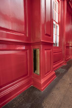 Earthfast post of the original, 1705 house was repaired in the 1