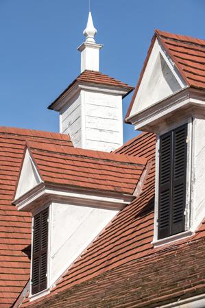 18th-century pedimented dormers and cupola
