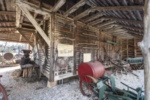 Walls pulled in and open sheds added to the 18th-century crib ab
