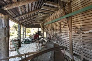 Walls pulled in and open sheds added to the 18th-century crib ab