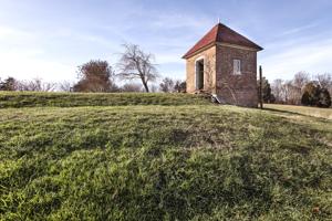 Privy dating to about 1800, set on edge of terraced garden