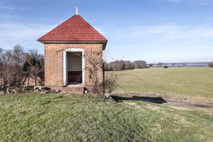 Privy dating to about 1800, set on edge of terraced garden