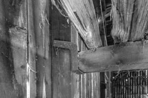 Wrought-iron strap carrying shed joist
