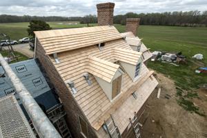 Recreated shingle roof with swept valleys on back building dorme