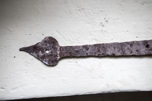 Finial on hand-forged strap hinge