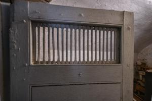 Wrought-iron grille in wine vault door