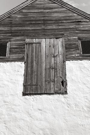 oard and batten loading door into upper half story