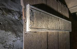Sash-sawn door in cellar assembled with hand-forged nails
