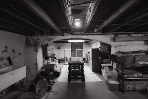 Masonry arch dividing sections of the cellar; early 19th century