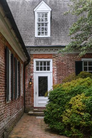 Double-ogee gauged-and-rubbed arch over door