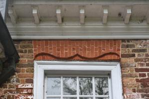 Double-ogee gauged-and-rubbed arch over door