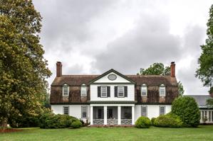 Upper level of porch on 1750s gambrel-roof house enclosed in 178