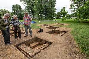 Weiss Erkelens and Cary Carson examining excavations of outbuild