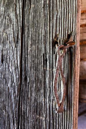 Hand-forged hasp on board-and-batten door