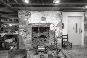 Cellar fireplace of ca. 1812 with later infill