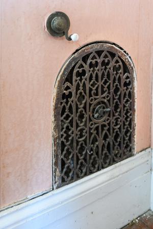 Original heating grate and bell pull in the drawing room