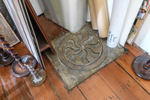 Original floor grate in dining room