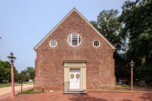 West faacde. Upper gable rebuilt during restoration adding more 