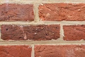 Bricks low on front wall with modest clay and iron inclusions, c