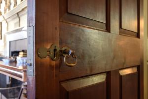 Moortise lock and brass furniture on mahogany drawing room door