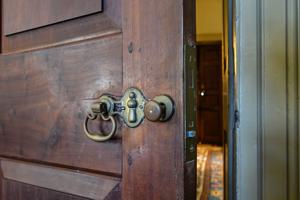 Moortise lock and brass furniture on mahogany drawing room door