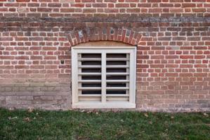 Cellar window and arch, east front, 1695-97