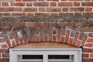 Cellar window and arch, east front, 1695-97