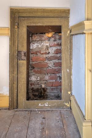 Blocked doorway that originally accessed kneewall of wing; ca. 1