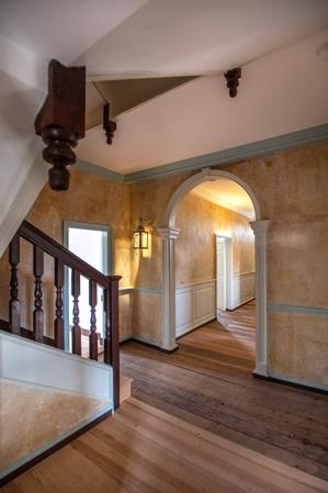 Passage improved in 1769 with yellow limewash on stucco scored t