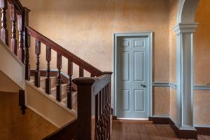 1705 staircase in original stair tower; archway and wall finishe