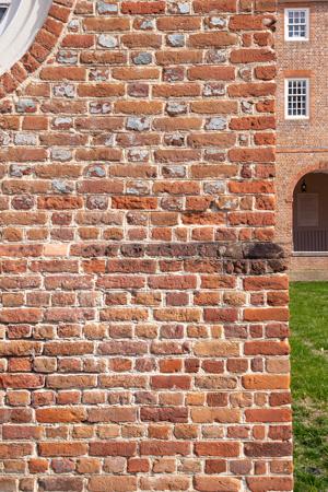 English bond plinth and glazed header Flemish bond wall above wa