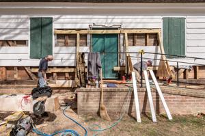 David Weir and John O'Rourke replacing portions of rotted sills 
