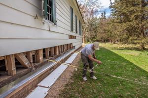 Bill lane, Jr., west side pulling replacement sill on east into 