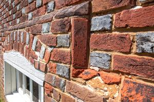 Cut-and-rubbed water table bricks on front; 1722