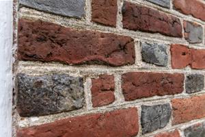 Slop-molded (water-struck) brick, ca. 1725 (south wall)