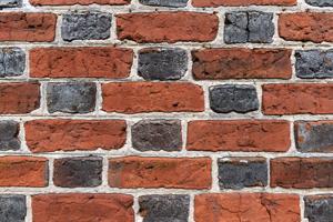 Detail of glazed header Flemish bond made with slop-molded brick
