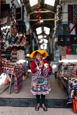 Young girl in native costume at market