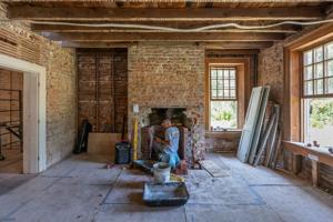 Original chimney in hall; stairs were between fireplace and righ