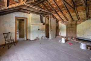 Original second floor quarter above kitchen; 1760s. Walls raised